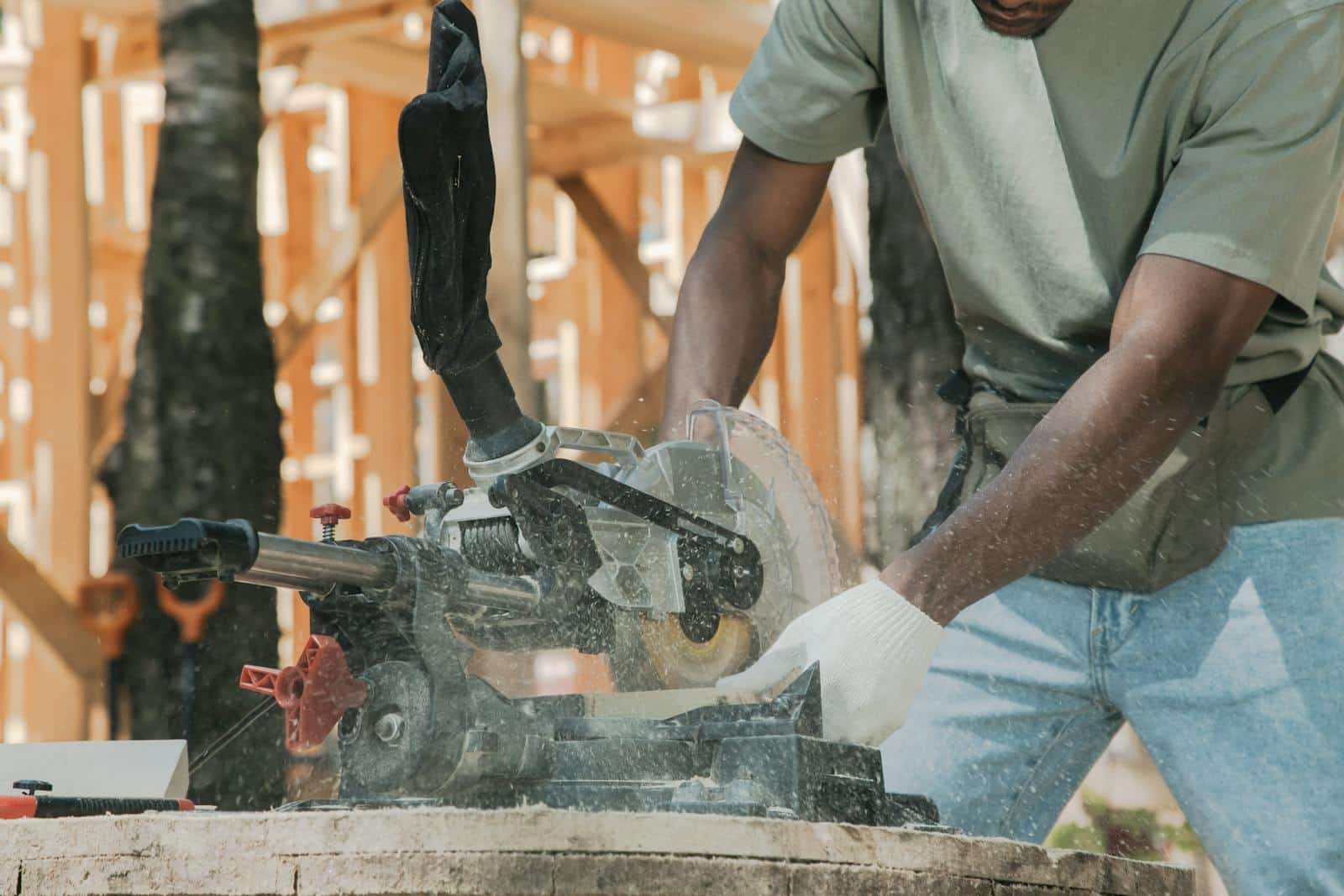 Action shot of a carpenter using a circular saw outdoors, demonstrating precise craftsmanship.