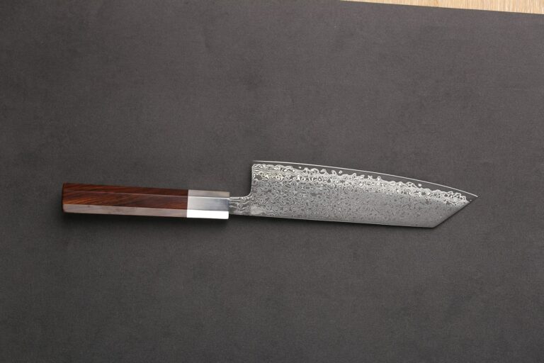 a knife on a cutting board with a wooden handle