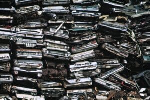 a pile of old cars sitting next to each other