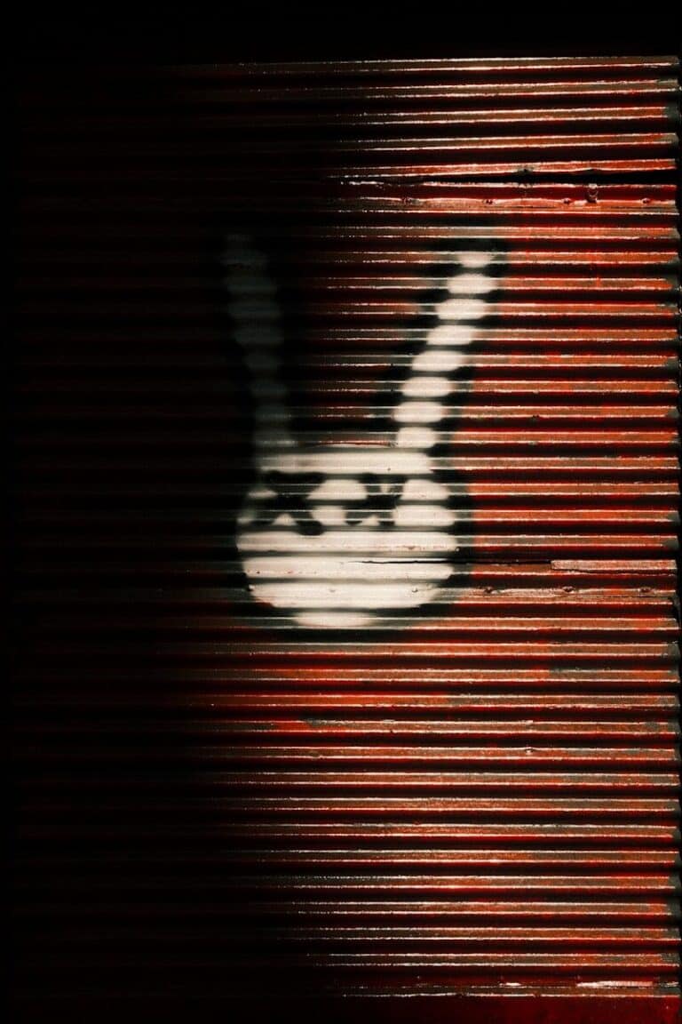White rabbit stencil on corrugated metal