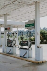 Old gas pumps sit at an abandoned station.