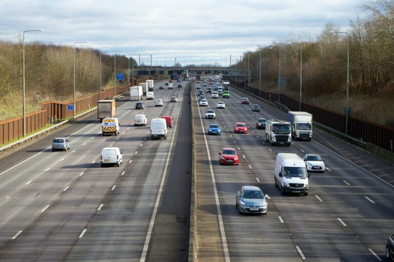 Aerial view of vehicles on a busy highway outside St Albans, England during daytime.