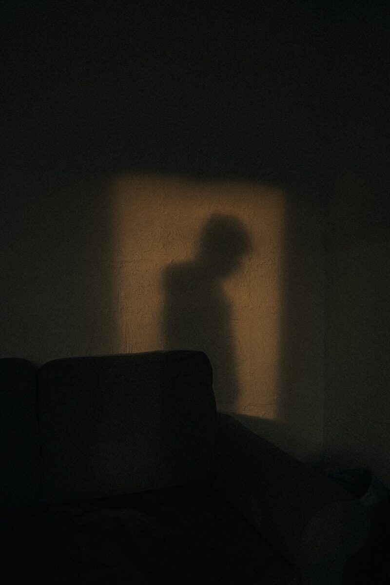 black sofa chair near white wall