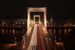 time lapse photography of cars on bridge during night time