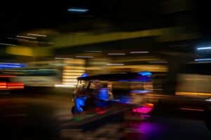 A blurry photo of a vehicle driving down a street