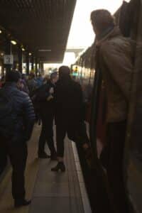 people standing on train station during daytime