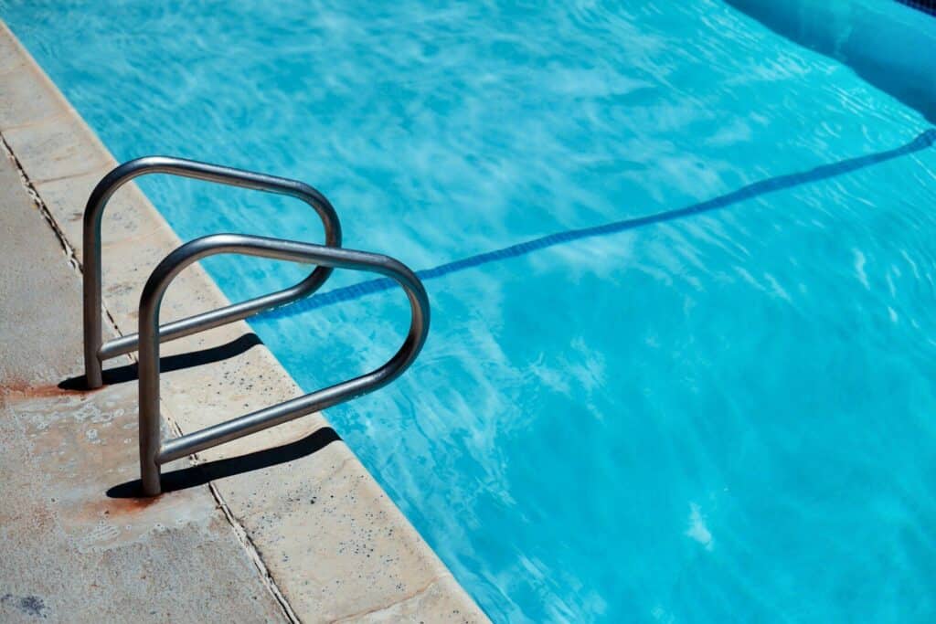stainless steel railings beside swimming pool