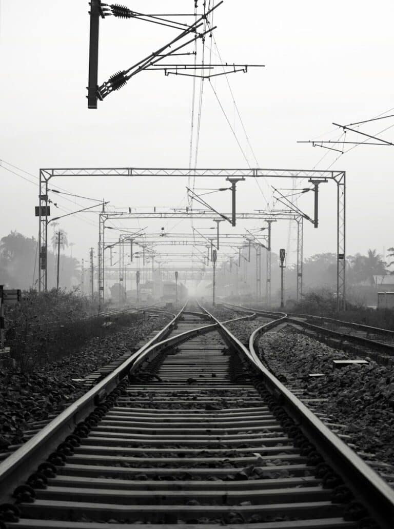 black metal train rail tracks