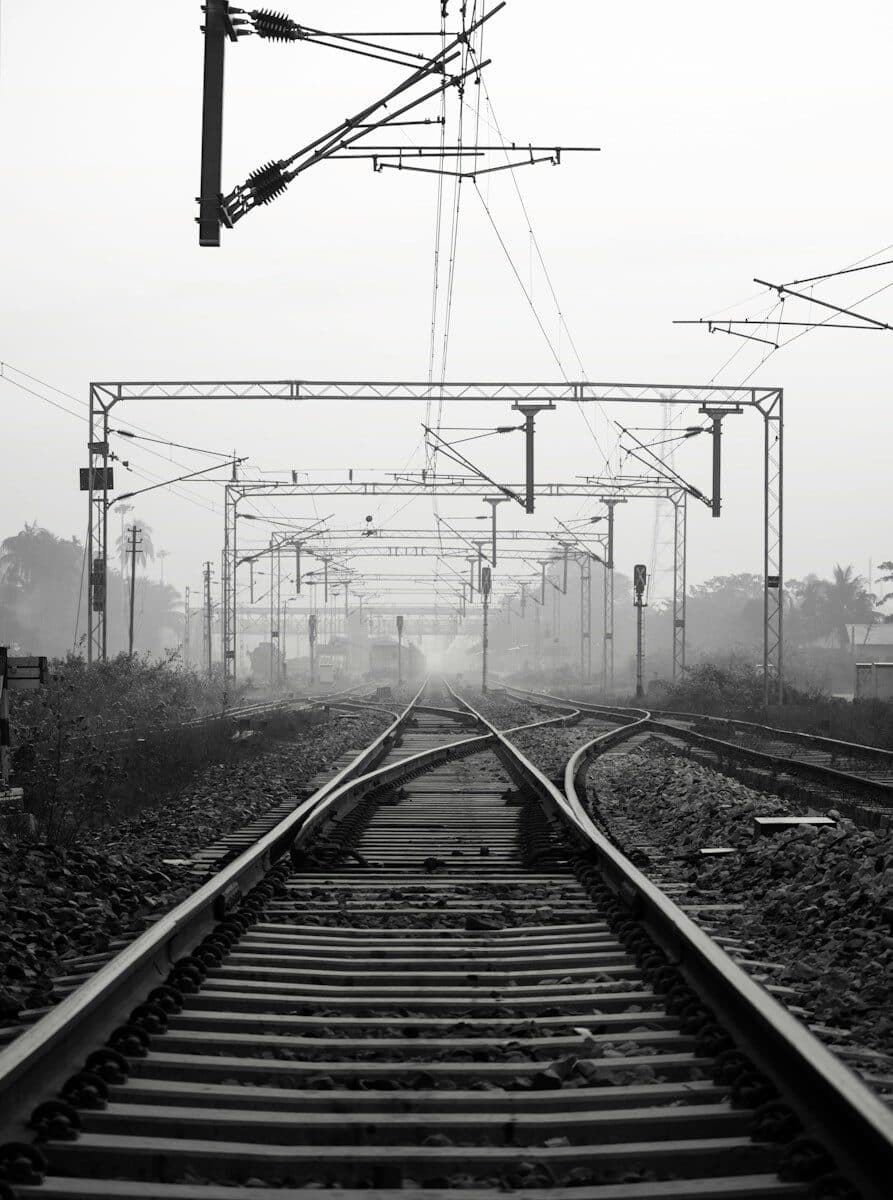 black metal train rail tracks