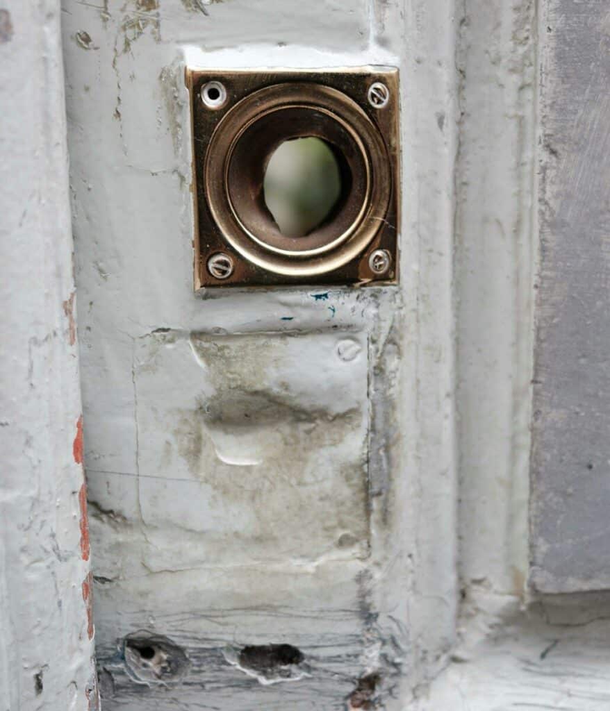 Close-up of an old brass door knocker attachment