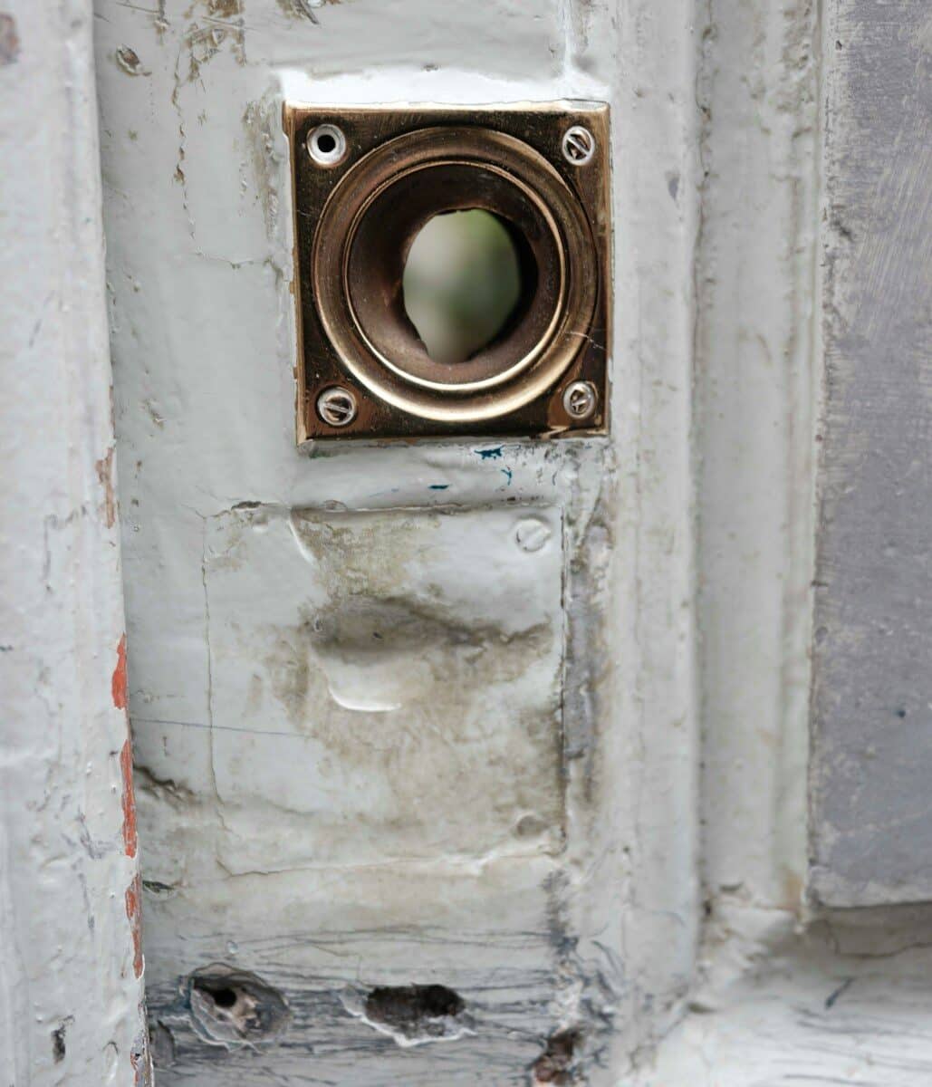 Close-up of an old brass door knocker attachment