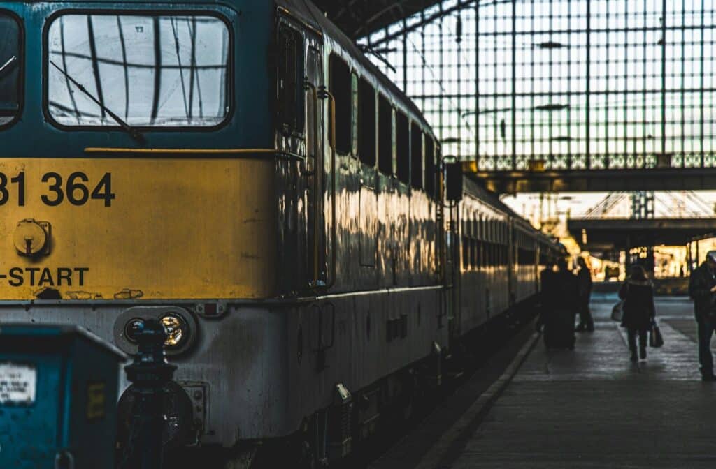 yellow and black train on train station during daytime