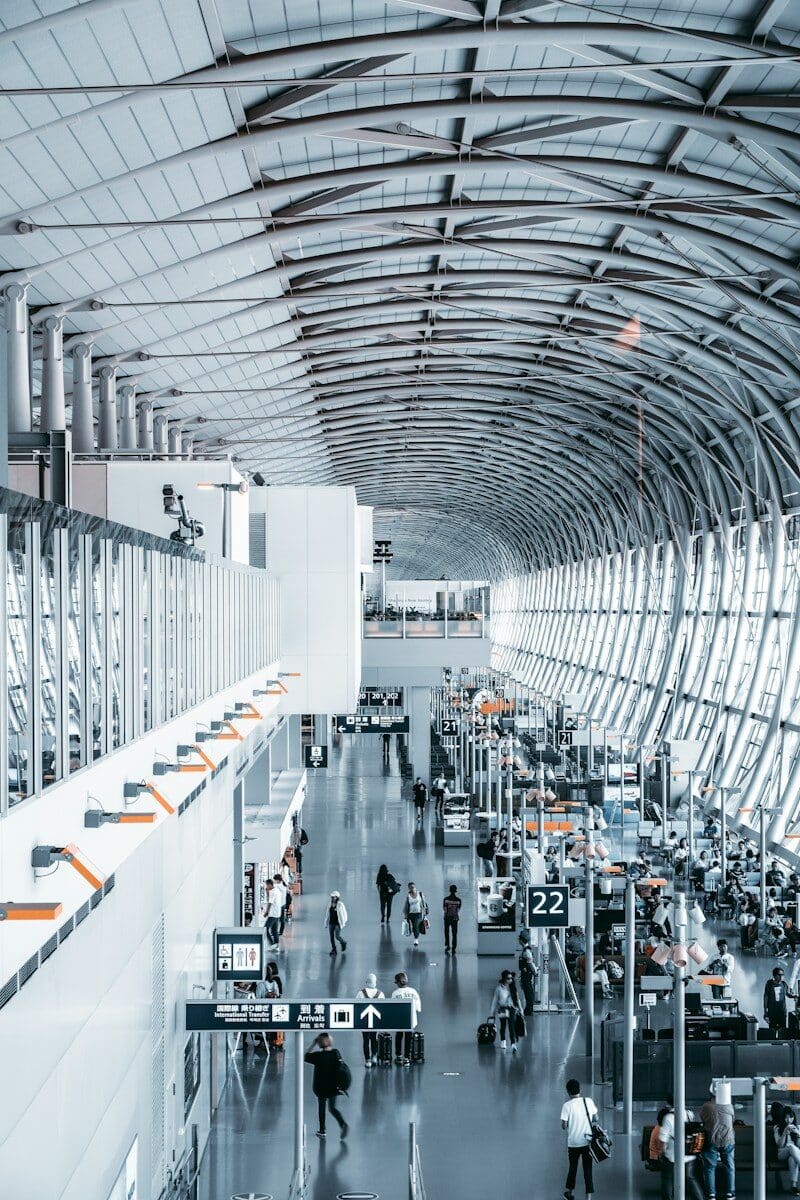 people walking inside airport station